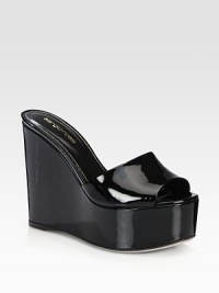 A curved wedge heightens this sleek patent leather slide. Self-covered wedge, 5 (125mm)Covered platform, 2 (50mm)Compares to a 3 heel (75mm)Patent leather upperLeather lining and solePadded insoleMade in Italy