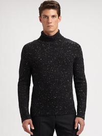 Speckled tweed lends an extraordinary finish to a cold weather classic, shaped in pure merino wool.Ribbed knit collar, cuffs and hemMerino woolHand washImported