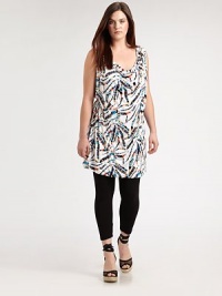 A festive print meets a design offering classic, draped details. This will be a figure-flattering tunic that you will love to wear with skinny jeans or leggings. Draped necklineSleevelessAllover printSelf-tie detail at backPull-on style About 37 from shoulder to hem94% venezia/6% spandexDry cleanMade in USA