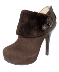 Cuffed and cute. GUESS's Oleta faux fur booties make a statement with a side buckle and zip up back.