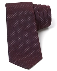 Rendered in plush silk for a lavish touch, this fine skinny width tie maintains classic appeal with an allover pattern of micro-sized dots.