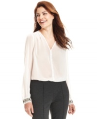 A floaty, semi-sheer top is dressed up with chunky beaded cuffs for a look both high in contrast and style. From Ellen Tracy. (Clearance)