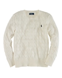 An essential crewneck sweater is rendered in cable-knit cotton for a timeless, preppy aesthetic.