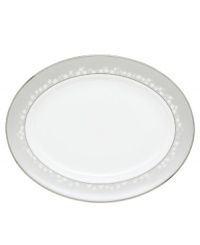 To entertain with grace and style look no further than this Bellina oval platter from Lenox's dinnerware and dishes collection. Elegant bone china with a delicate floral design and textured white beads is finished with platinum trim. Platter shown back.