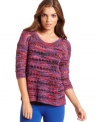 With a textured multi-colored knit, this Kensie sweater adds a bold splash of bright to your cold-weather look!