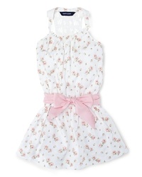 Absolutely charming dress in soft floral cotton jersey with a crocheted racerback silhouette and a pretty sash.