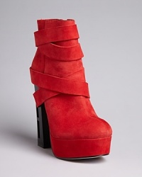 Soft suede straps wrap around the ankle and through the heel of Dolce Vita's platform Jyll booties.