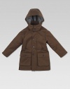 Crafted in plush cotton, this waterproof, flannel-lined, hooded parka has a full-zip front with buttoned covering