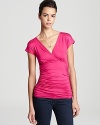 A work wear basic is slyly chic--thanks to ruching and a crossover neckline on this Sweet Pea top.