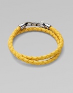 A handsomely braided leather bracelet with bold color and wrap-around styling. Leather About 3 diam. Spring clasp Made in Italy 