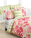 This breezy bedding design from Tommy Hilfiger features clustered hydrangeas in shades of vibrant coral over a watercolor green ground. Damask stripes on soft white shams and the comforter's reverse present classic, sophisticated style for your modern bedroom.