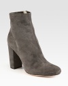 On-trend ankle boot rendered in fine suede with an easy side zip. Self-covered heel, 4 (100mm)Suede upperSide zipperLeather lining and solePadded insoleImported