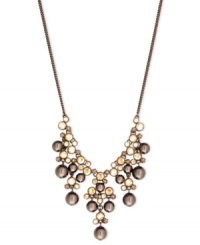 Go for the bold with this frontal drama necklace from Givenchy. Crafted from brown gold-tone mixed metal, the necklace makes a strong fashion statement with gorgeous glass pearl and cubic zirconia accents. Approximate length: 16 inches + 2-inch extender.