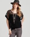 The boxy shape of this Free People top is offset by elegant lace, for a look with ladylike-cool appeal.