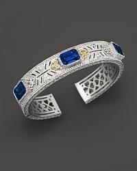 Sterling silver cuff set with faceted white sapphires and corundum. By Judith Ripka.