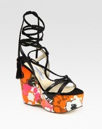 Vibrant, floral-print wedge with leather straps and braided suede laces that make their way up the ankle, concluding with tassels. Self-covered wedge, 5 (125mm)Covered platform, 2 (50mm)Compares to a 3 heel (75mm)Leather and suede upperLeather lining and solePadded insoleMade in ItalyOUR FIT MODEL RECOMMENDS ordering true size. 