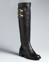 Flat-out fashionable, these tall boots by Rachel Zoe feature eye-catching, luxe golden button details on each shaft that make these standbys stand out.