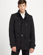 A clean silhouette tailored in performance nylon for a modern edge against the elements, it features a stand collar, shoulder epaulettes and spacious front pockets.Button frontStand collarShoulder epaulettesZippered chest pocketWaist flap pocketsBack ventFully linedAbout 30 from shoulder to hemNylonDry cleanImported