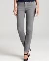 Gleaming silver-tone hardware enhances the stormy hue of these MICHAEL Michael Kors jeans, cut in a slim silhouette for downtown edge.