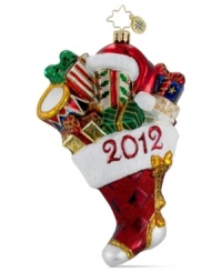 Stuff a stocking or trim the tree with Christopher Radko's Presents-A-Plenty ornament, crafted of dazzling Polish glass. Festive wrapping paper, glitter from heel to toe and a blazing-red 2012 commit the season to memory.