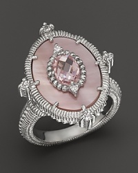 A pink mother-of-pearl and crystal sterling silver ring with white sapphire accents. By Judith Ripka.