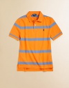 A short-sleeved polo shirt is cut in soft, breathable cotton with a bold striped pattern.Ribbed polo collarShort sleevesFront button placketUneven vented hemCottonMachine washImported Please note: Number of buttons may vary depending on size ordered. 