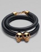 Two iconic, crystal accented skull beads on a luxurious, wrapped leather cord. Leather cordSilvertone brassCrystalsLength, about 14Lobster clasp closureMade in Italy