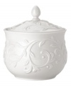 An elegant white-on-white pattern featuring an embossed vine motif and interior glaze lends the Opal Innocence Carved sugar bowl to refined dining every day.