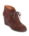 Lucky Brand adds interest to basic booties with bold metallic grommets and oversized laces.