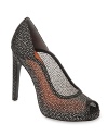 Sheer genius, these Via Spiga platform evening pumps feature mesh uppers with a sparkling finish.