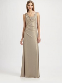 Fluid metallic jersey, in an artfully draped, floor-length style accented with a beaded shoulder detail.ScoopneckShoulder drape with beaded detailSleevelessEmpire seamSide gathers at waistBack cutout with gathered drapeAbout 42 from natural waist95% polyester/5% spandexDry cleanMade in USA of imported fabricModel shown is 5'10 (177cm) wearing US size 4. 