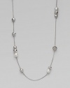 From the Elements Collection. Luminous South Sea pearls and carved sterling silver beads are stationed on an elegant strand of sterling silver. Gorgeous worn either super long or doubled up.South Sea pearl Sterling silver Length, about 48 Lobster Clasp Imported