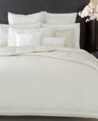 This Modern Classics White Gold sham from Donna Karan features plush texture and a soothing colorway for an impeccable addition to your bed. Finished with silk trim. Button closure.