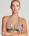 Turquoise-colored, jewelry style accents give this Trina Turk bikini top a retro-luxe aesthetic.