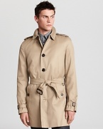 A single breasted silhouette lends a clean, timeless look to a classic Burberry trench.