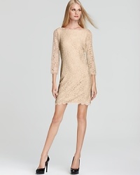 Crafted in romantic lace, this DIANE von FURSTENBERG dress is the epitome of elegance, with a classic boatneck and sheer sleeves.