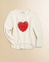 Sending hearts aflutter, this cute plush knit features a trendy hi-lo hem and tender appliqué.ScoopneckLong sleevesPullover styleHi-lo hem95% viscose/5% spandexHand washImported