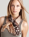 Look fierce in this zebra and cheetah printed scarf from Salvatore Ferragamo.