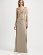 Fluid metallic jersey, in an artfully draped, floor-length style accented with a beaded shoulder detail.ScoopneckShoulder drape with beaded detailSleevelessEmpire seamSide gathers at waistBack cutout with gathered drapeAbout 42 from natural waist95% polyester/5% spandexDry cleanMade in USA of imported fabricModel shown is 5'10 (177cm) wearing US size 4. 