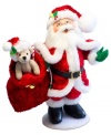 Santa at his best. The jolliest man on Christmas dons a red velour suit and bag of toys and treats in this quintessential holiday figurine. With the soft features and unmistakable style of Annalee dolls.