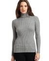 THE LOOKRibbed allover knitTurtleneckLong sleevesFitted shapeTHE FITAbout 23 from shoulder to hemTHE MATERIALCashmereCARE & ORIGINHand wash or dry cleanImportedModel shown is 5'8 (173cm) wearing US size Small. 