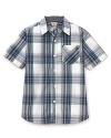 A cool, crisp summer look, the short sleeve button-down shirt is rendered in a large plaid, with topstitch accents and a patch pocket at the chest.