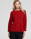 A classic boat neckline and allover ribbed-knit design enrich this soft Vince sweater this season.