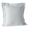 A solid pique throw pillow with a hemstitch border adds classic style.