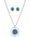 Feeling the blue. Kenneth Cole New York puts you in a good mood with this pendant and drop earrings set. The necklace is crafted from silver-tone mixed metal with a blue glitter disc in the pendant and a pair of drop earrings to match. Items come packaged in a signature Kenneth Cole New York Gift Box. Approximate length: 16 inches + 3-inch extender. Approximate pendant drop: 1-1/2 inches. Approximate earrings drop: 3/4 inch.