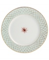 An intricate gold lattice pattern frames a single starburst in the center of the striking Etoiles dinner plates from Bernardaud.