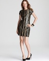 Wavy sequin stripes lend festive sparkle to a short sleeve Aidan Mattox dress, rendered in a simple sheath silhouette.