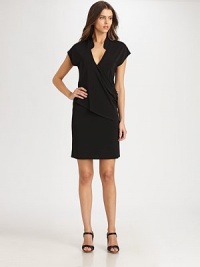 The LBD re-imagined, this jersey design features a classic mandarin collar leading to a seductive v-neckline and a fashion-forward draped, asymmetrical front. V-necklineShort sleevesDraped, asymmetrical bodice detailAbout 39 from shoulder to hem70% rayon/24% polyester/6% spandexDry cleanImported Model shown is 5'11½ (181cm) wearing US size Small. 