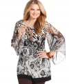 Style&co. masterfully blends paisley and animal prints with this plus size tunic top-- finish the look with leggings!