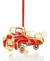 Steer this blazing red fire truck into your tree. Handcrafted in solid brass with gold rims and ladders, it's an authentic replica of the classic vehicle. From Baldwin.